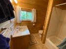 Upstairs bathroom with a standard tub and shower.