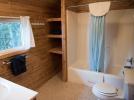 Upstairs bathroom with standard tub shower.