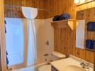 Bathroom with a standard tub shower.