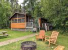 Exterior of Lincoln with picnic table, firepit, and seating.