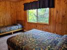 Upstairs bedroom with a queen and twin bed.