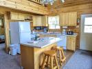 Kitchen with a stove, refrigerator, and dishwasher.