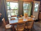 Dining room with a table for 6 and beautiful views of the lake.