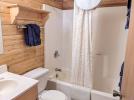 Main floor bathroom with a standard tub shower.