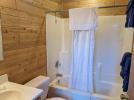 Main floor bathroom with a standard tub shower.