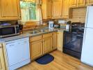 Kitchen with a standard refrigerator, stove, and dishwasher.