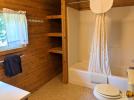 Upstairs bathroom with a standard tub shower.