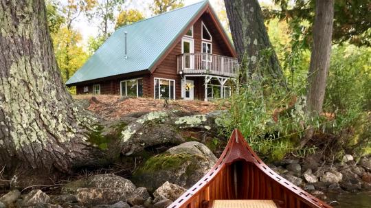 Private Lake Vermilion Cabin with wooden boat in foreground