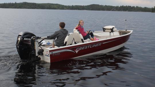Brother and sister fishing in 60HP boat on Lake Vermilion