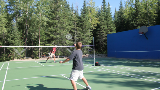 Father and son playing badminton