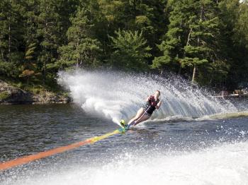 Experienced water skier being towed