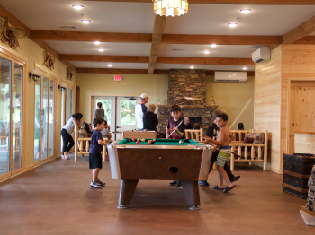 Children play pool in the Main Lodge