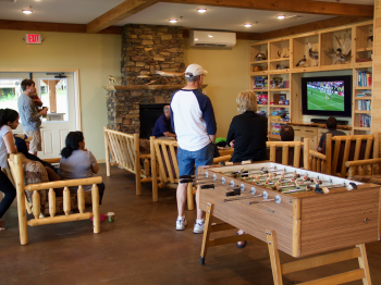 Guests gather around the TV in the Main Lodge