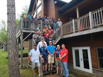 A retreat group on the stairs of the Grand Vermilion Chalet