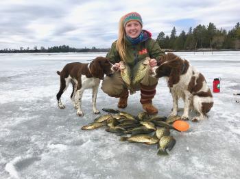 Woman ice fishes during Lake Vermilion winter
