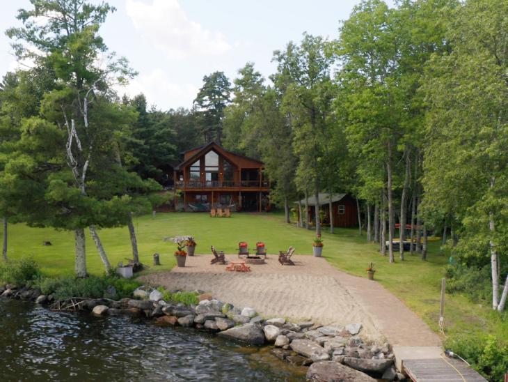 Patio with fire pit, sand beach and expansive, flat yard