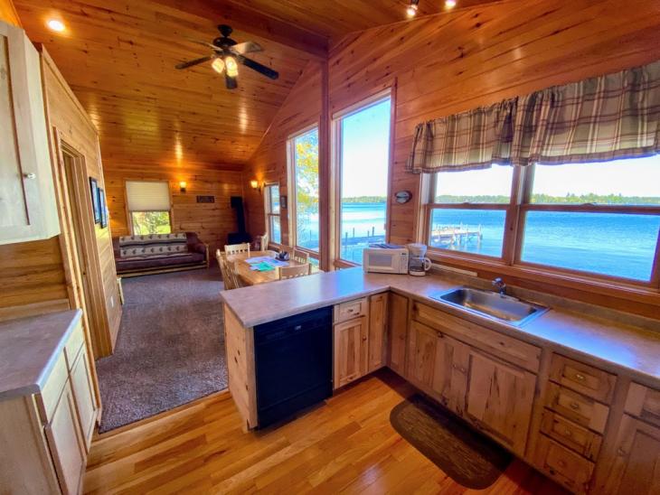 Kitchen with stove, refrigerator, dishwasher and views of the lake.