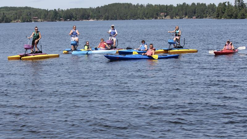 Large group of kayakers and hydro-bikers