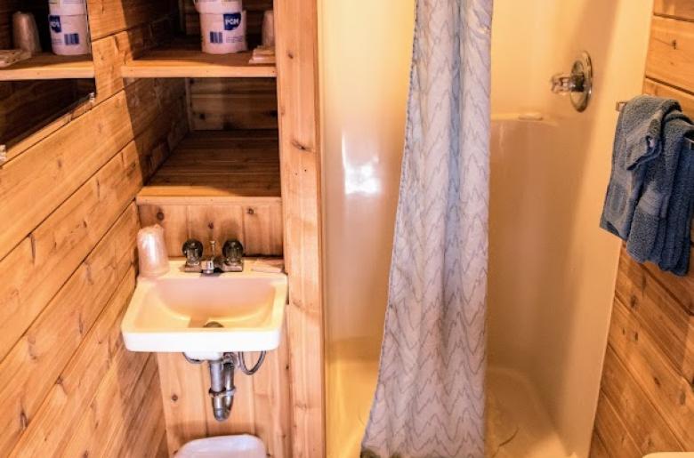 Small bathroom with a shower stall.