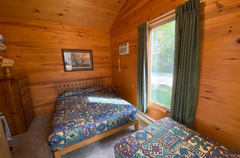 Bedroom with a queen and twin bed.