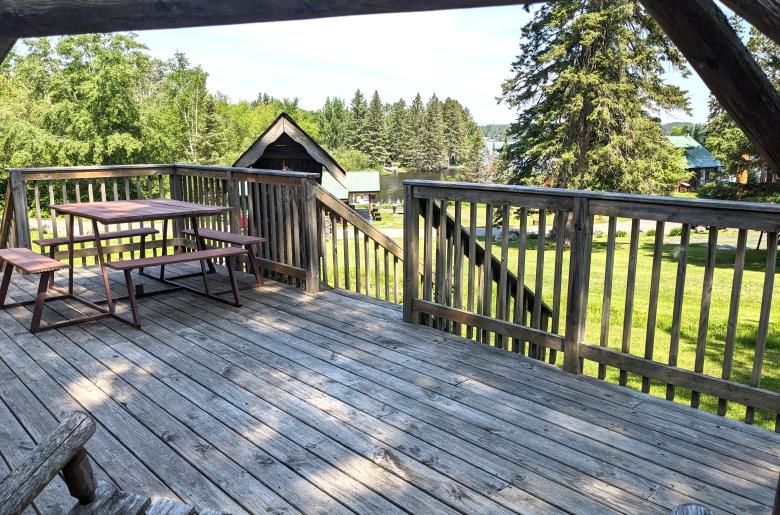 Deck seating overlook the harbor and bait and tackle shop.