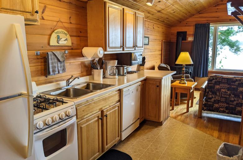 Kitchen with a refrigerator, stove, and dishwasher.
