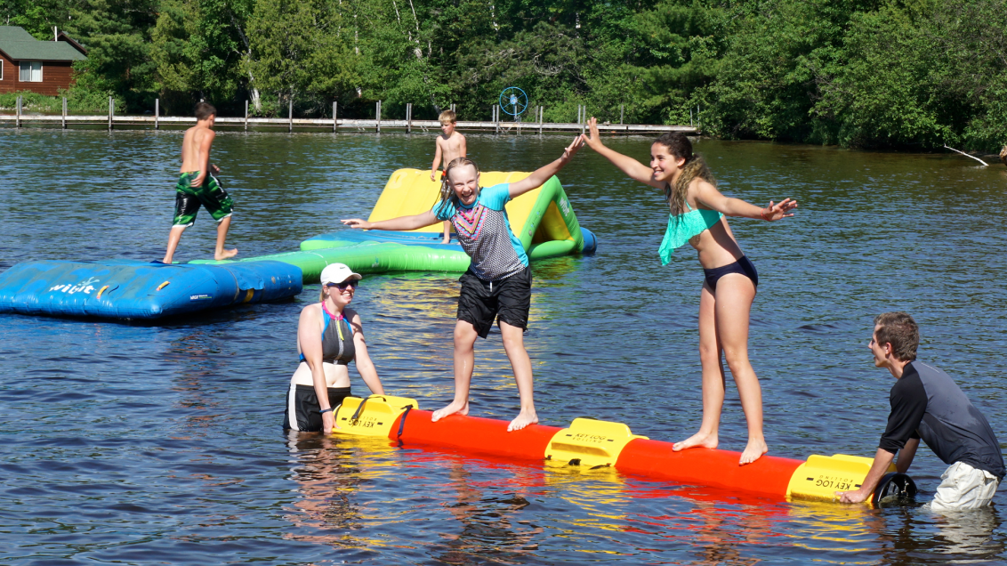 Children play at the beach at Pehrson Lodge