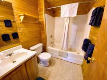 Bathroom with a standard tub/shower.