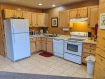 Kitchen with a refrigerator, stove, and dishwasher.