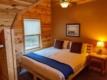 Upstairs bedroom with a king bed.