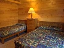 Bedroom with a queen and twin bed.