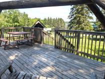 Deck seating overlook the harbor and bait and tackle shop.