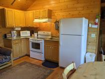 Kitchen with a refrigerator and stove.