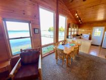 Dining area with seating for 6 that overlooks the lake.