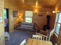 Living are with a futon and chair.