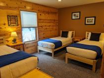 Main floor bedroom with two XL twins and one regular twin.