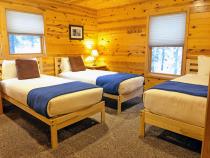 Master bedroom with two XL twins, one regular twin, and an ensuite bathroom.