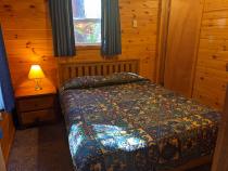 Bedroom with a queen bed and ensuite bathroom.