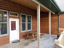 Deck entrance with picnic table.