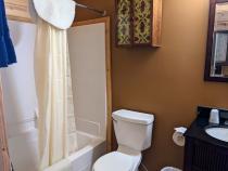 Upstairs bathroom with a standard tub/shower.