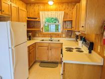 Kitchen with a refrigerator, stove, and dishwasher.