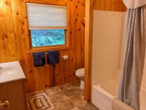 Upstairs bathroom with a standard tub/shower.