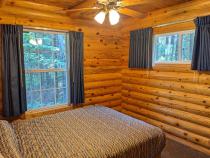 Main floor bedroom with a queen bed.